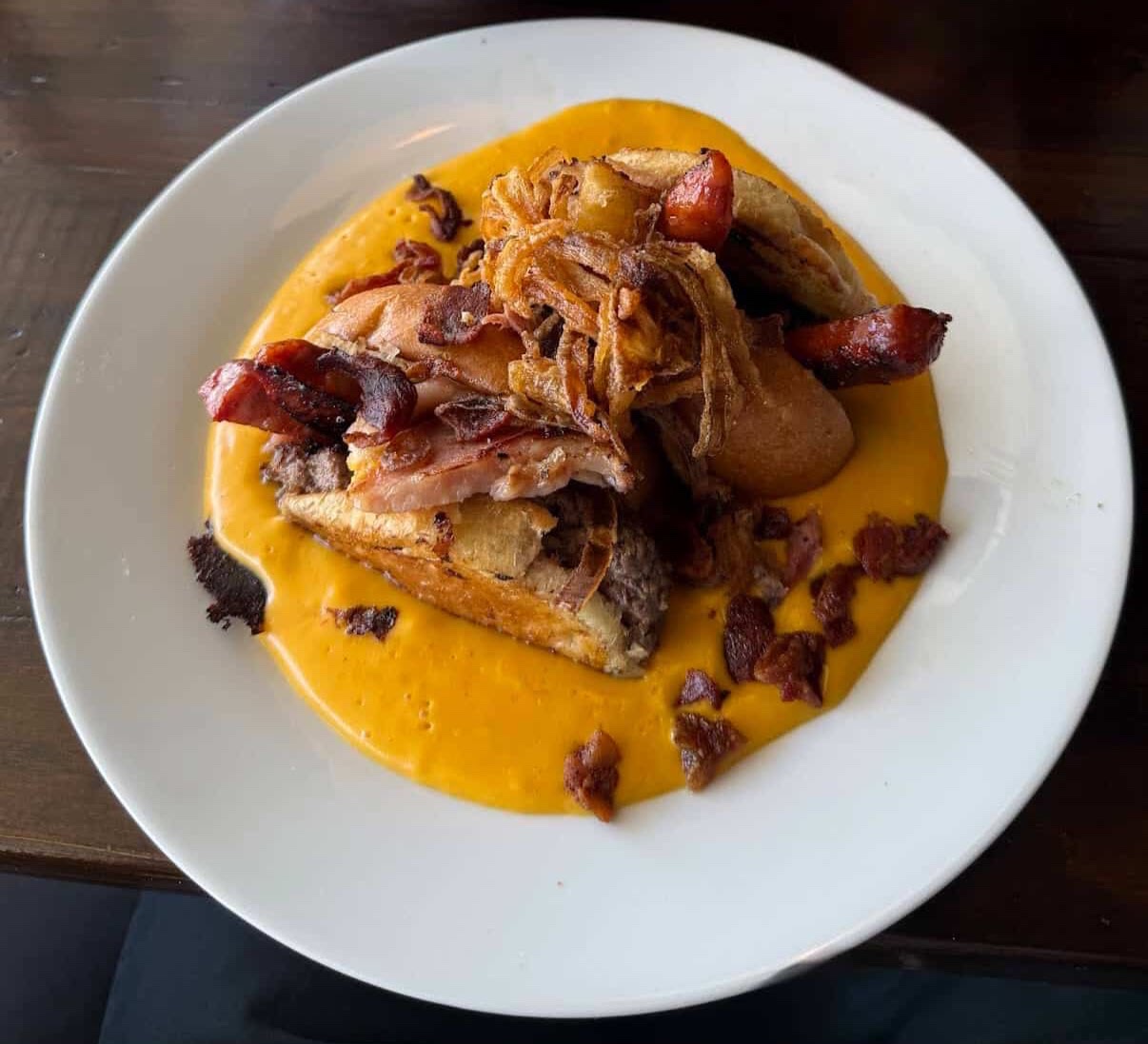 Chorizo bilbao stack with crispy onions in cheese sauce